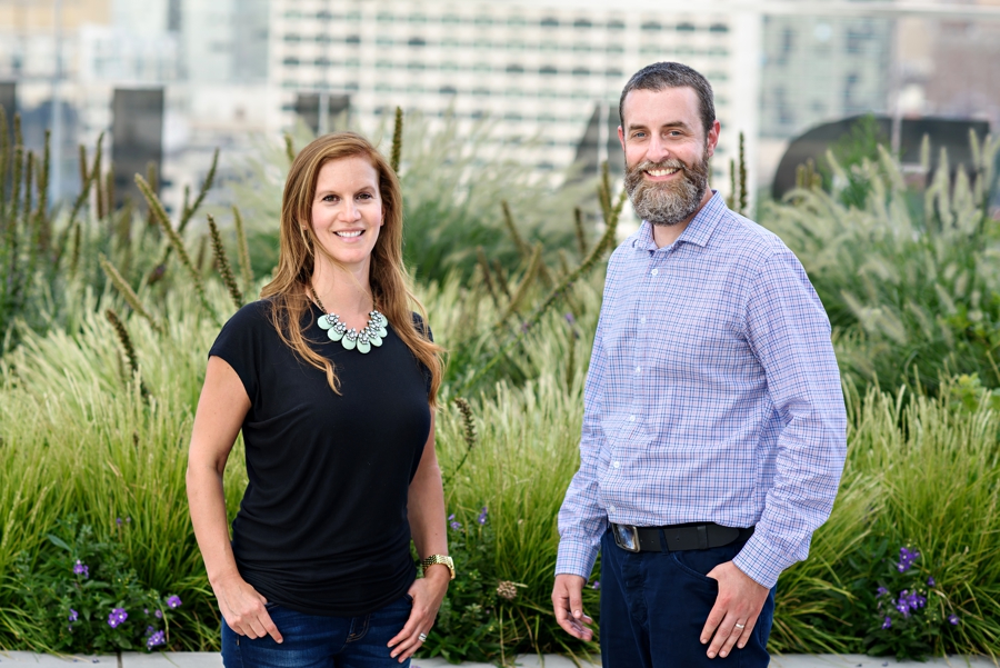 Podcast hosts pose for a brand photo.